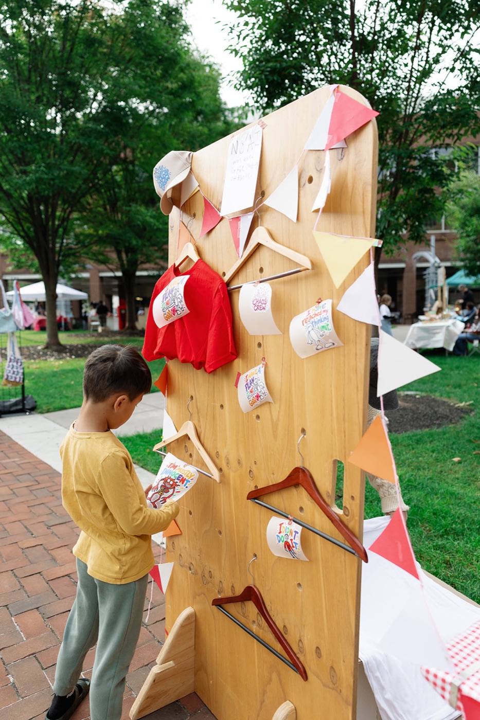 Hand-painted shirts hanging on a display